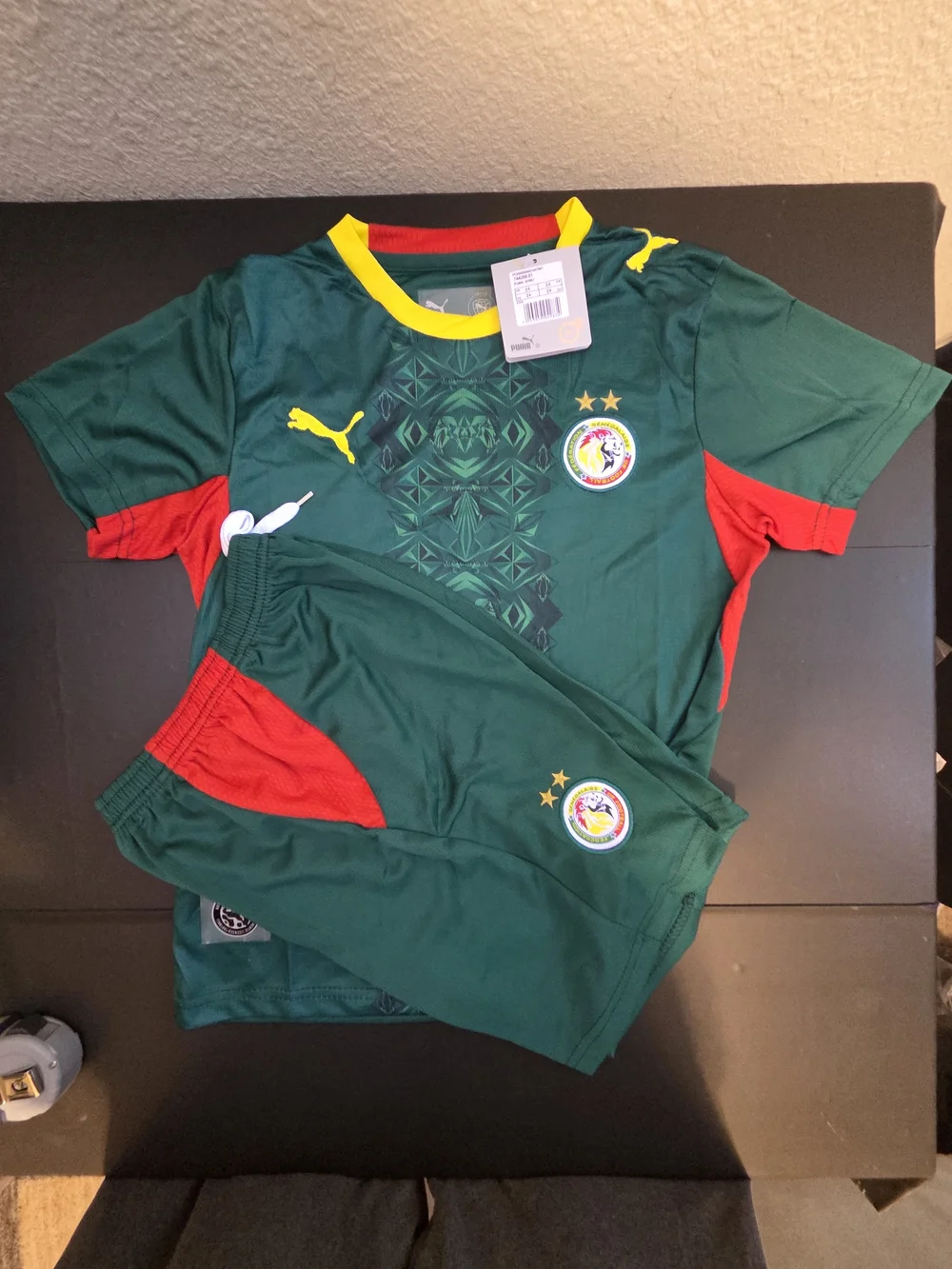 Puma Kids Green Jersey and Shorts Set with Red & Yellow Accents